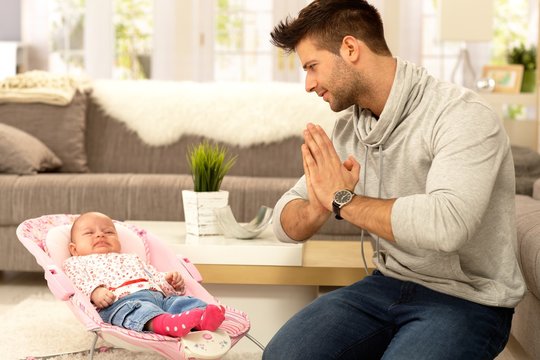 Desperate Father With Crying Baby