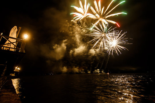 Fireworks shine over the water