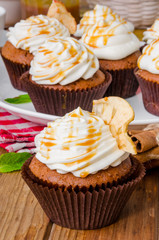 Carrot cupcakes with walnuts and butter cream on top