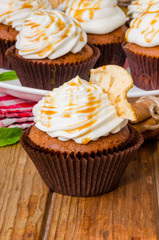 Carrot cupcakes with walnuts and butter cream on top