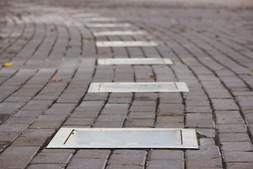 Outdoor Lighting on ground  installed in stone pavement.  path with night illumination.