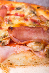 Closeup macro view pizza ham mushrooms