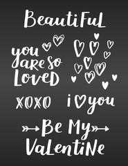 Obraz premium Valentines day hand written quote set on chalkboard black background. White chalk lettering made with love for your design and invitations.