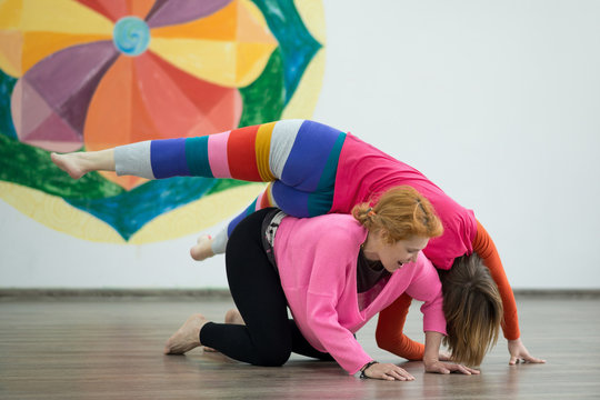 Two women dancing dance contact improvisation