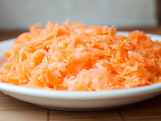 Grated carrots in bowl