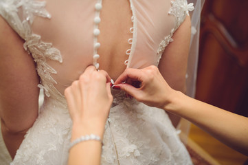 Girl Buttoning Dress