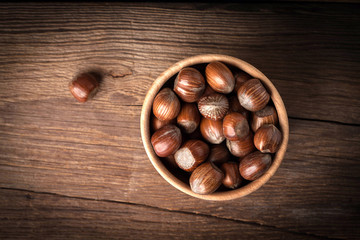 Hazelnuts in wooden bowl.