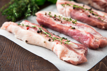 Raw meat. Pork ribs with herbs and spices