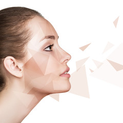 Young woman with geometrical shapes on face