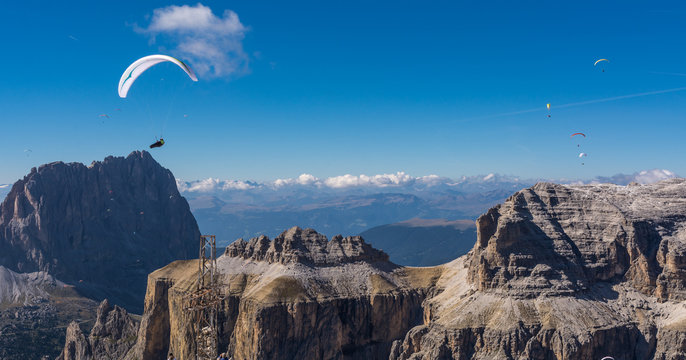 Paraglider flying over mountains
