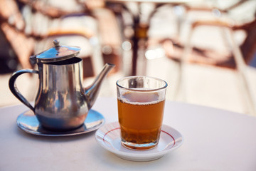 Traditional Moroccan mint tea in a cafe of Marrakech, Morocco