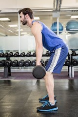 Fototapeta na wymiar Muscular man lifting barbell