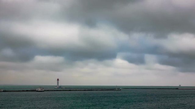 Lighthouse and Ships with dramatic clouds. Time Lapse.
