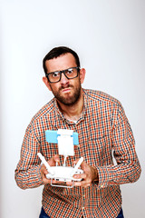 Man holding drone controler, isolated over white background mad.