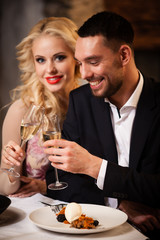 Couple celebrating in restaurant