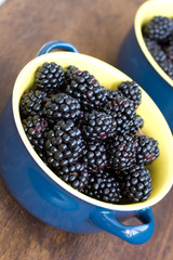 Blackberry in blue dish close up