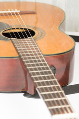 Acoustic guitar neck with frets with blurred background