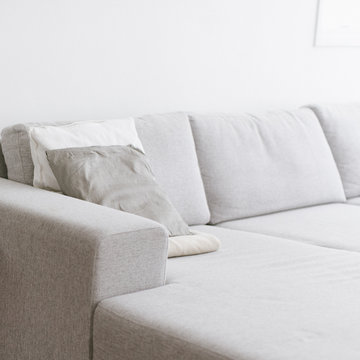 A Grey Couch With Pillows