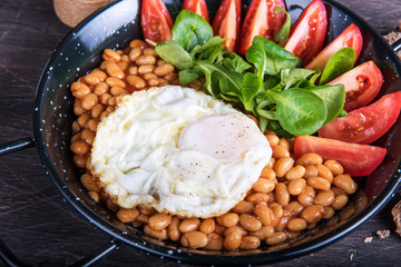 Fried eggs with beans
