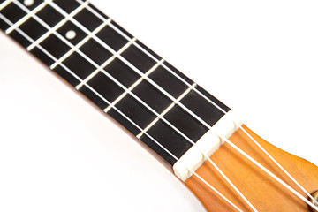 Ukulele close up in white background. Music concept.