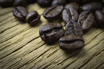 Coffee beans on wood background