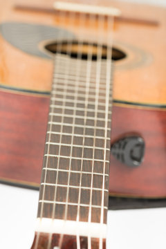 Acoustic guitar neck with frets with blurred background