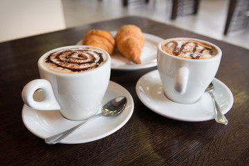 Two cups of cappuccino