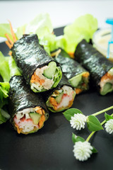 closeup Salad roll in black dish