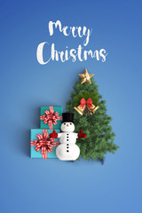 merry christmas and chirstmas tree on color background