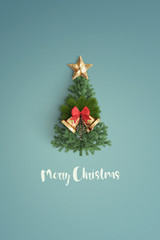 merry christmas and chirstmas tree on color background