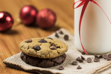 Cookies and Milk for Santa / Cookies and milk with Christmas decoration on a wooden background