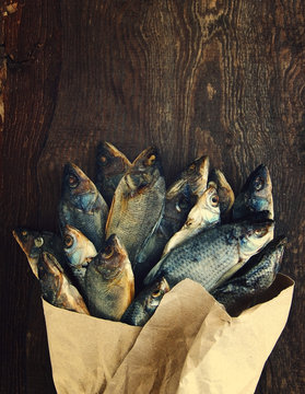 Bouquet from salty dry fish. Salty dry fish in a paper paper bag. Gift for men.