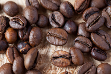 Closeup of coffee beans with focus on one