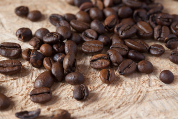 Closeup of coffee beans with focus on one