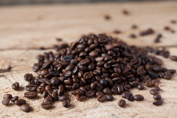 Obraz na płótnie Canvas Closeup of coffee beans with focus on one