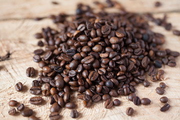 Fototapeta na wymiar Closeup of coffee beans with focus on one