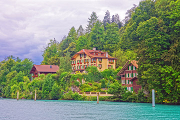 Fototapeta na wymiar Chalets in Interlaken and Brienz Lake in Bern Canton Switzerland