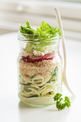 vegetarian couscous zucchini cheese salad in mason jar