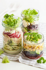 healthy vegetable cheese salad in mason jars