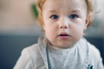 Toddler portrait. Boy looking at camera