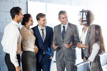 Businesspeople interacting in conference room