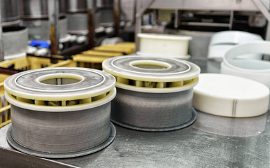 Gruyere de Comte Cheese pressed in special forms in dairy