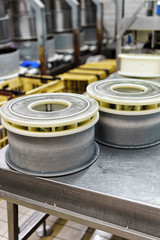 Gruyere de Comte Cheese pressed into special forms at dairy