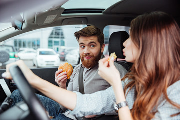 Couple eating in car