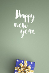 happy new year and gift boxes on color background