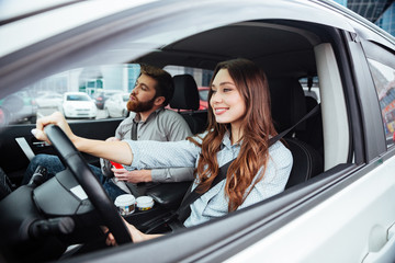 Side portrait of couple in car