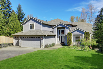 Traditional blue home exterior in Puyallup with wood siding