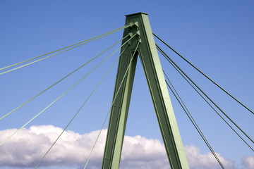 Part of the Severinsbrücke against a deep blue sky