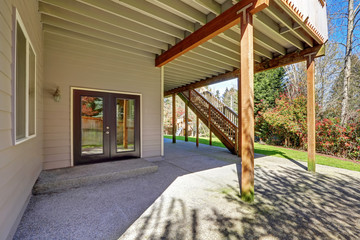 Backyard view of two story house