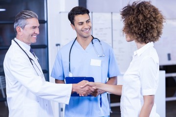 Doctor shaking hands with colleague